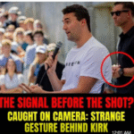 This is NOT a normal gesture—watch what the man behind Kirk does seconds before the shooting…